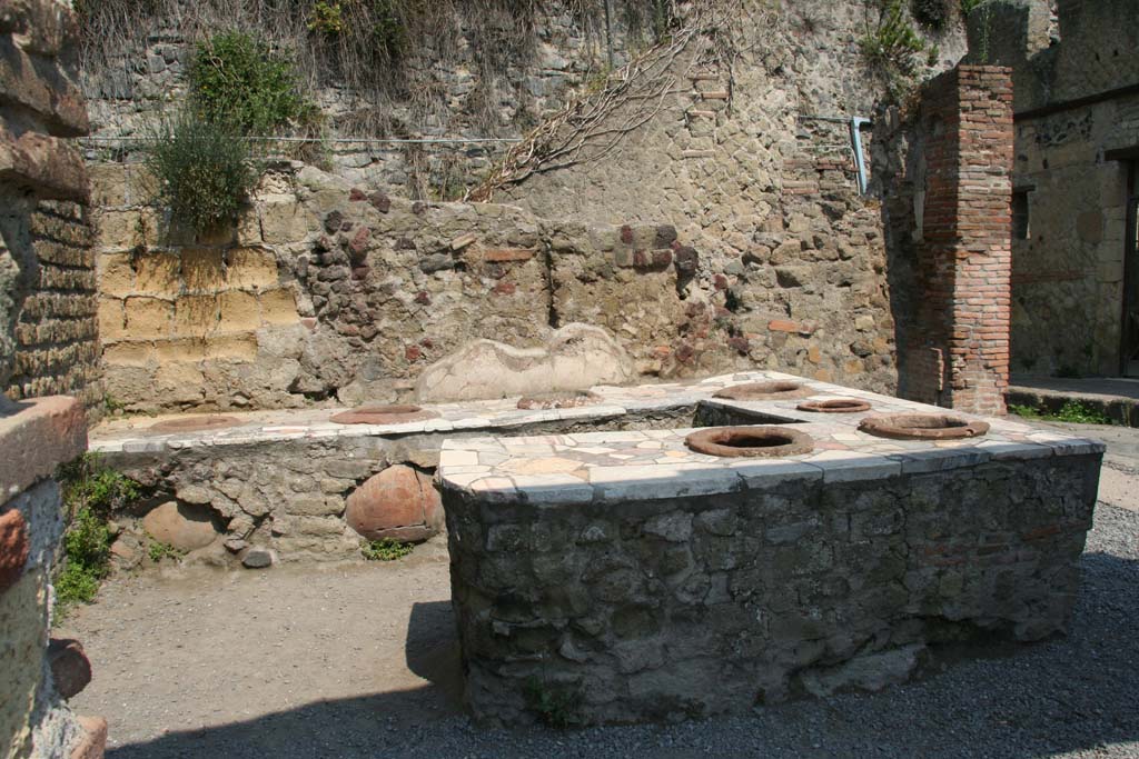 II.6 Herculaneum, April 2011. Looking west towards a three-sided podium. Photo courtesy of Klaus Heese.